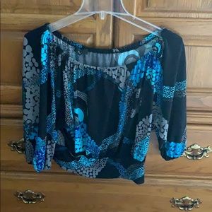 Quarter sleeve off the shoulder shirt